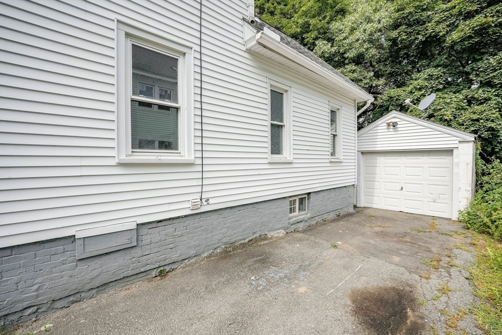 30 Beauchamp Street Springfield, MA 01107 - Photo 29 of 30 a view of a house with a yard and garage