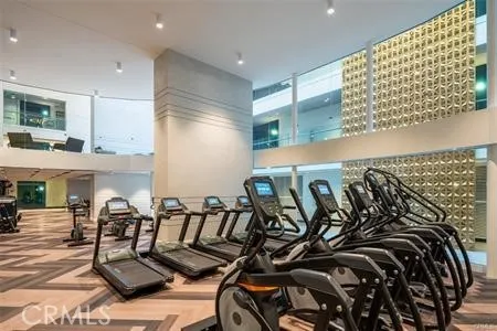 a view of gym equipment and kitchen view
