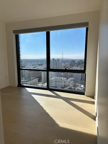 a view of an empty room with a fireplace