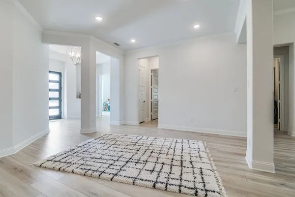 wooden floor in an empty room with an entryway