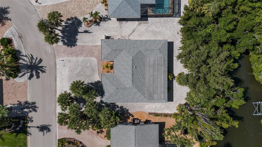 315 Avenida De Paradisio Sarasota, FL 34242 - Photo 26 of 27 an aerial view of a house with a yard