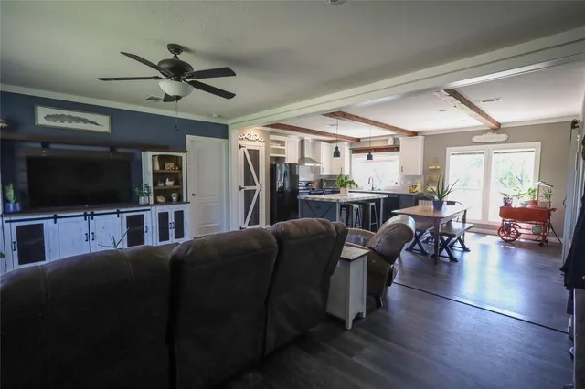a kitchen with granite countertop a sink appliances and cabinets
