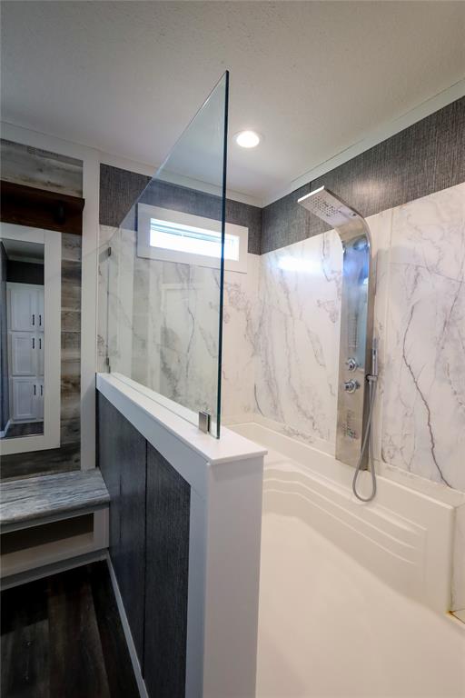 55 County Road West Comanche, TX 76442 - Photo 20 of 36 a bathroom with a shower and a tub