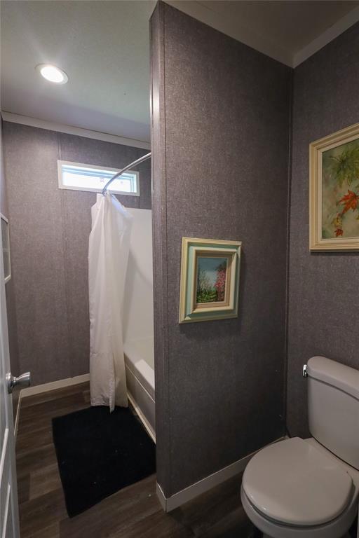 55 County Road West Comanche, TX 76442 - Photo 24 of 36 a bathroom with a toilet and a shower