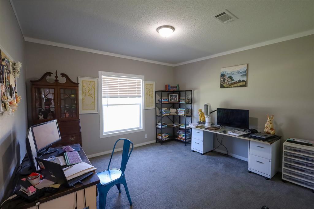 55 County Road West Comanche, TX 76442 - Photo 26 of 36 a view of a workspace with furniture and a window