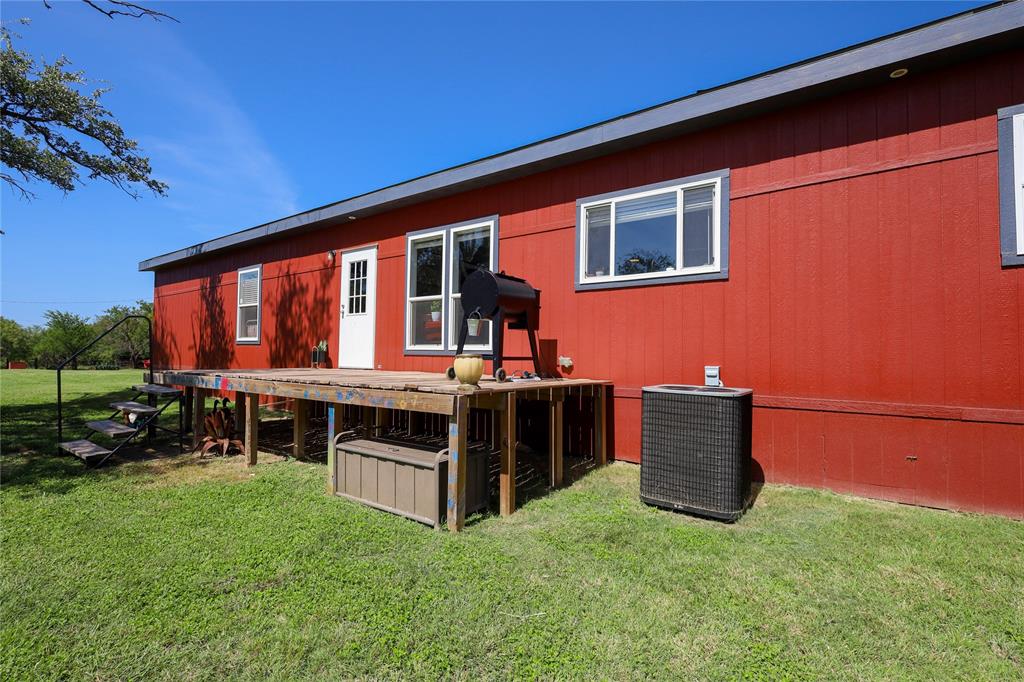 55 County Road West Comanche, TX 76442 - Photo 9 of 36 a view of house with a yard
