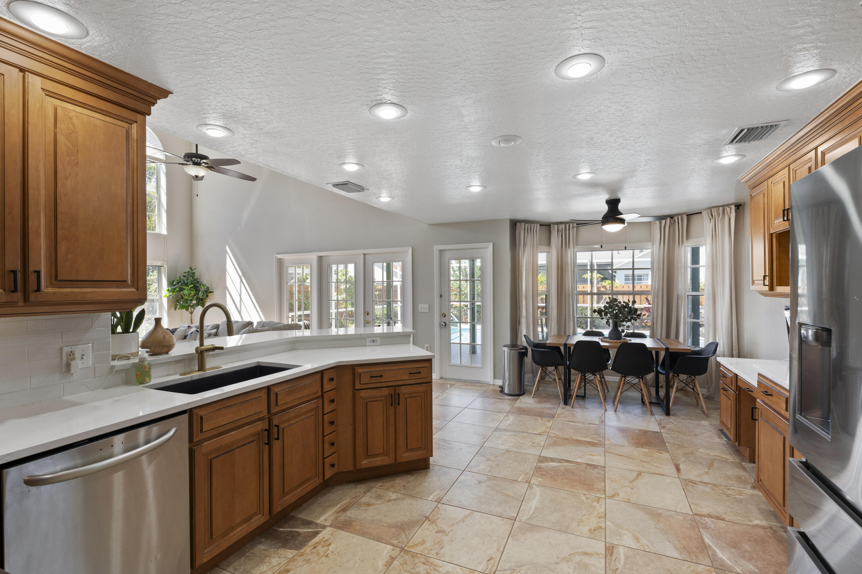 2639 Lowell Circle Melbourne, FL 32935 - Photo 18 of 46 a large kitchen with lots of counter and a sink