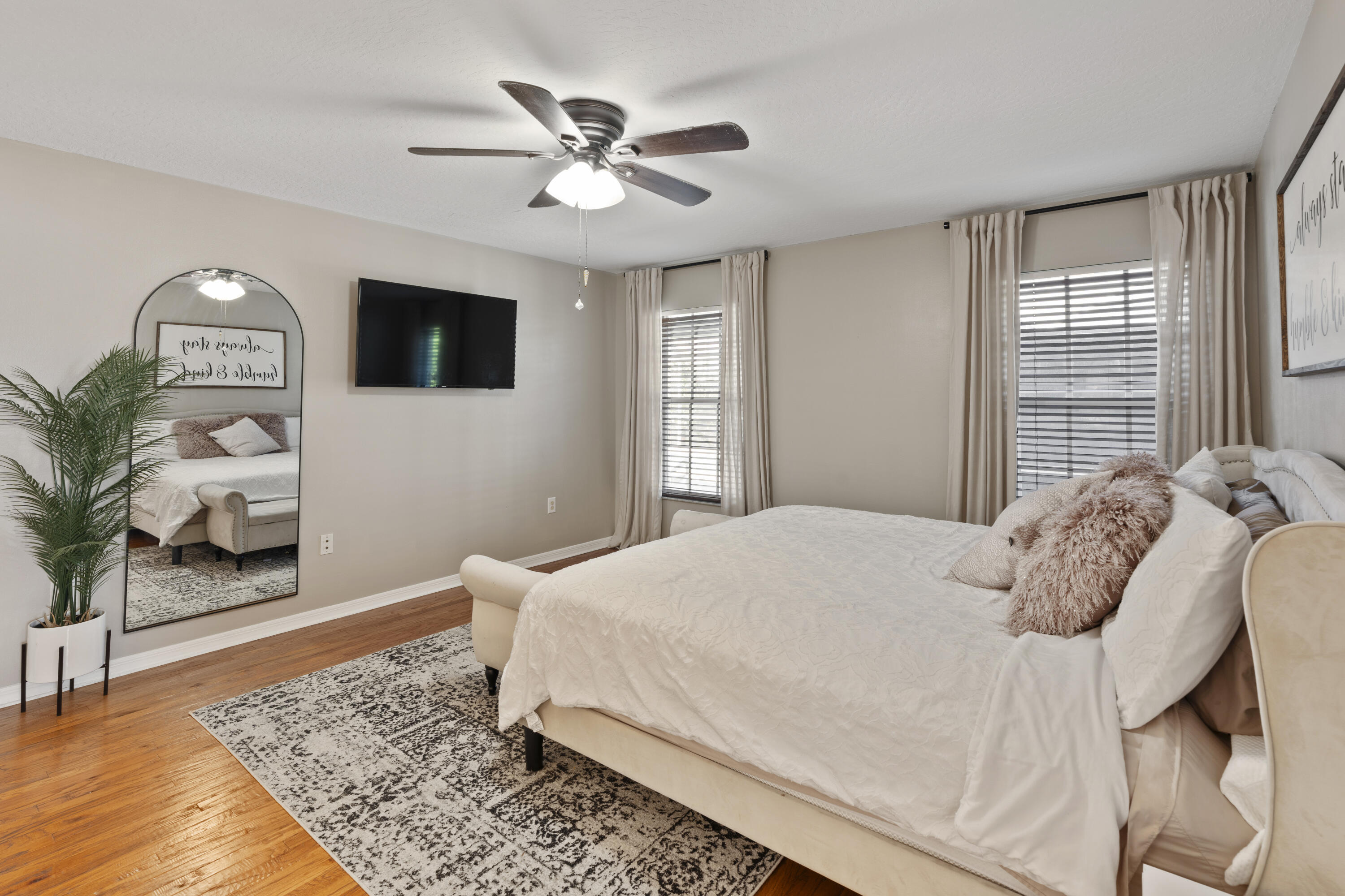 2639 Lowell Circle Melbourne, FL 32935 - Photo 20 of 46 a bedroom with a large bed and a window