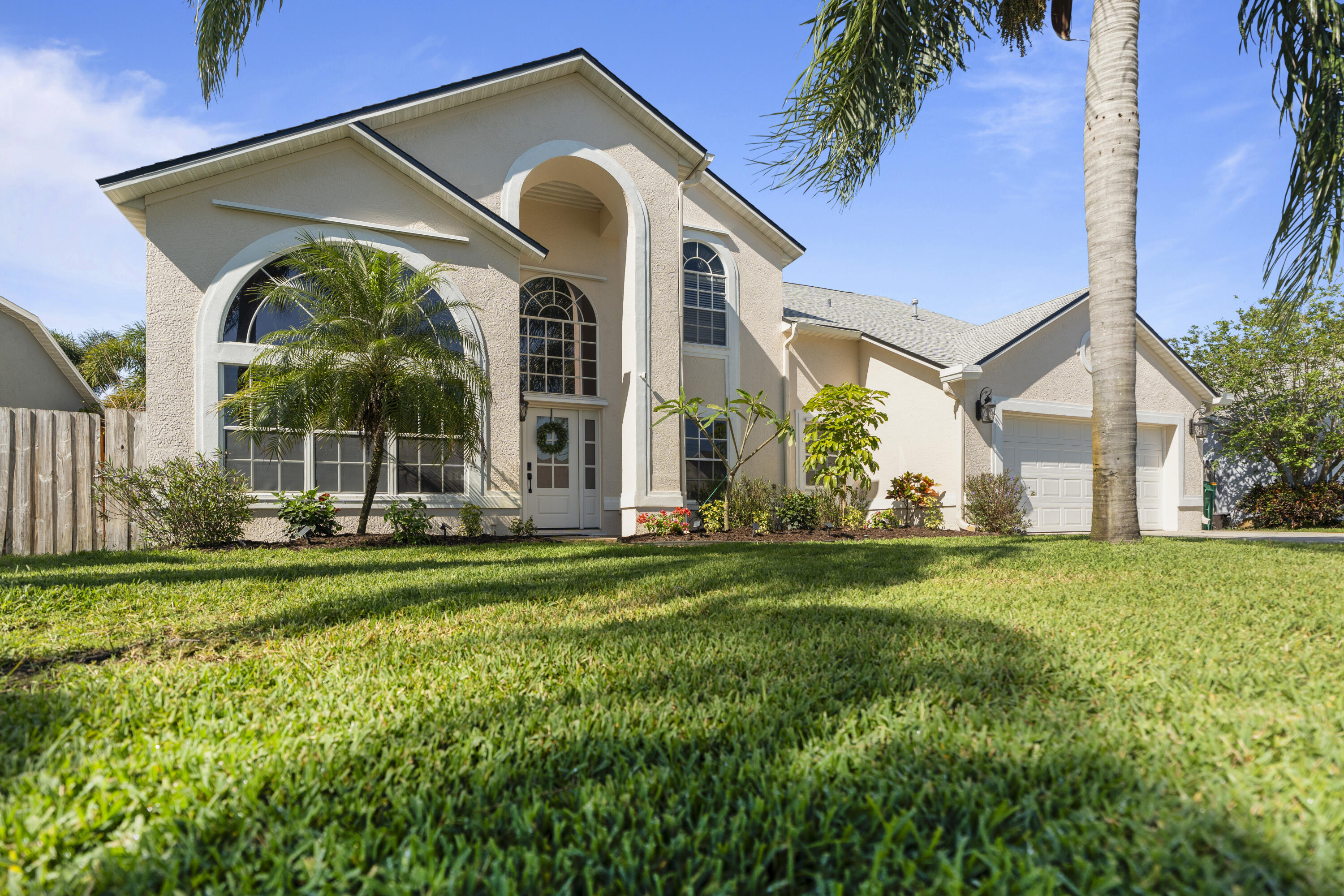 2639 Lowell Circle Melbourne, FL 32935 - Photo 2 of 46 a front view of house with yard and green space