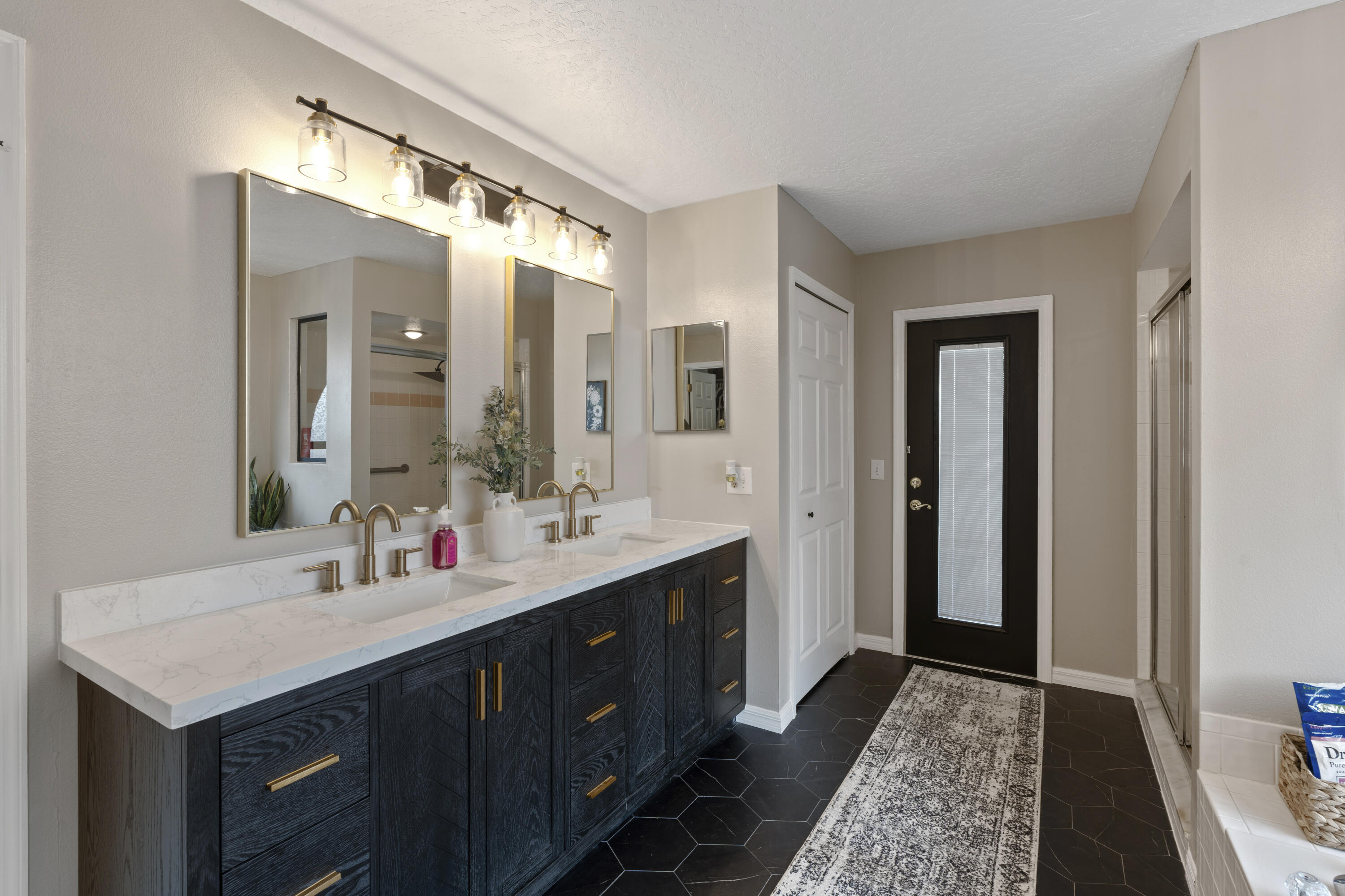 2639 Lowell Circle Melbourne, FL 32935 - Photo 23 of 46 a bathroom with a sink and a mirror