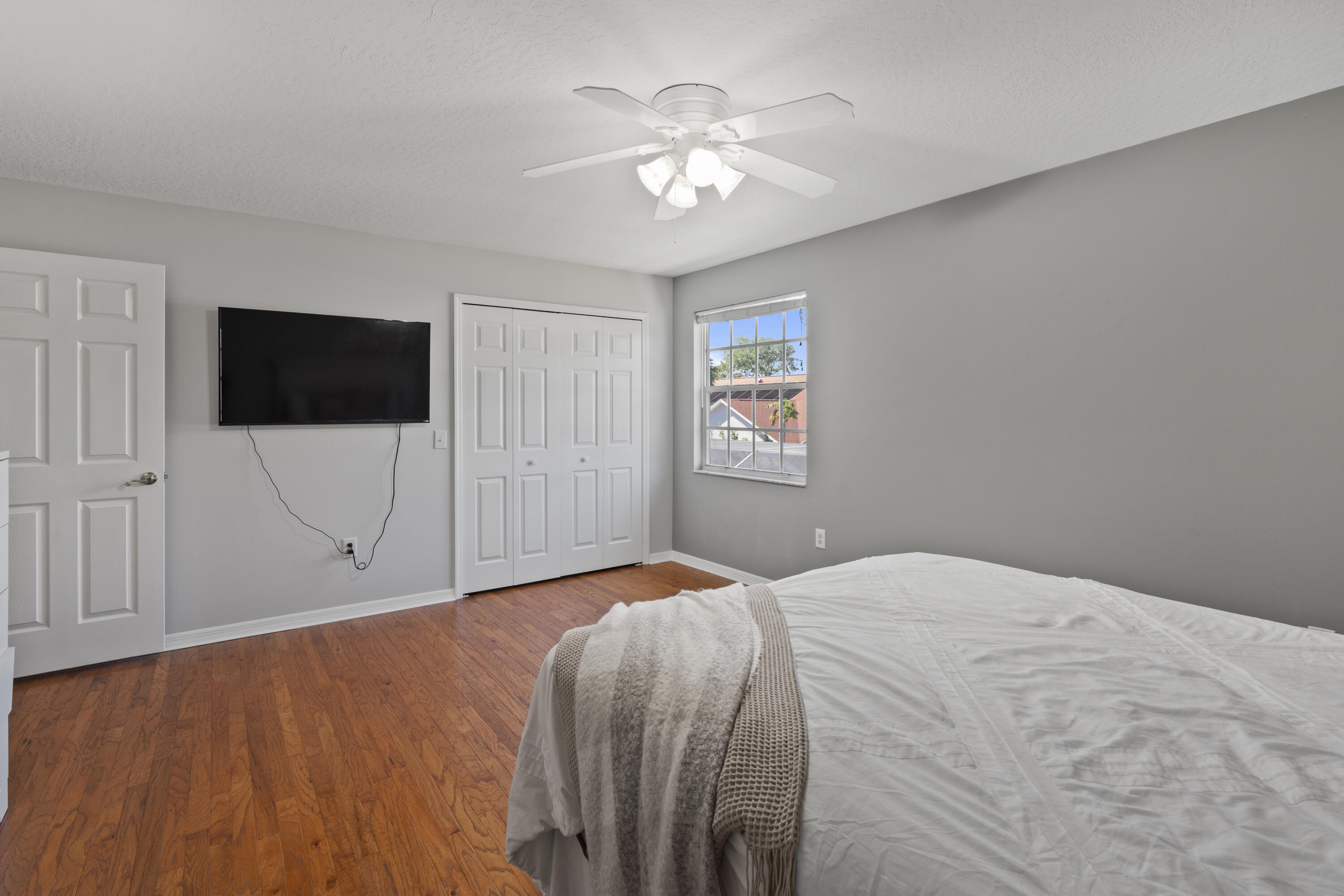 2639 Lowell Circle Melbourne, FL 32935 - Photo 33 of 46 a bedroom with a bed and a flat screen tv