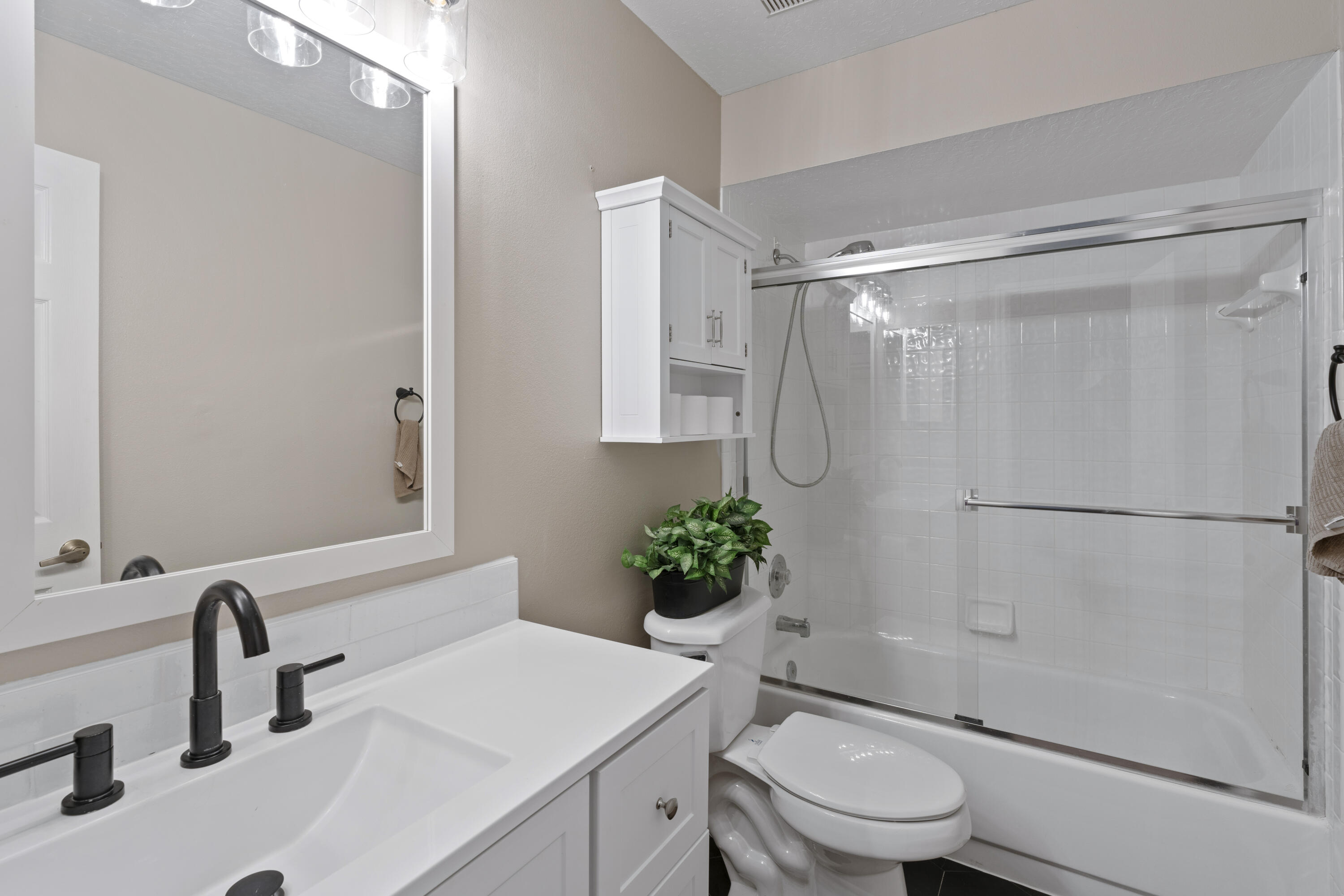 2639 Lowell Circle Melbourne, FL 32935 - Photo 34 of 46 a bathroom with a sink toilet and shower