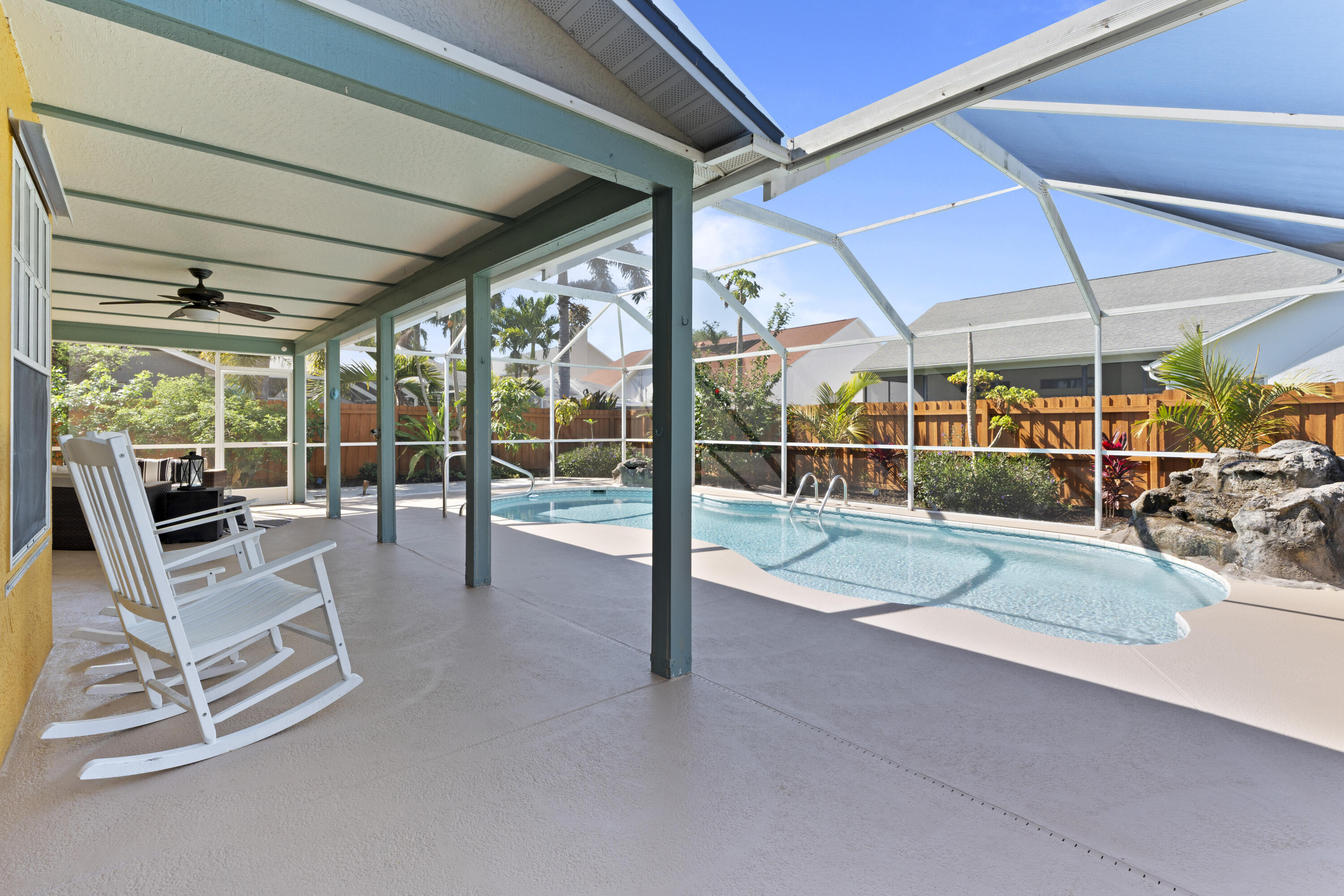 2639 Lowell Circle Melbourne, FL 32935 - Photo 42 of 46 a view of a patio with table and chairs under an umbrella