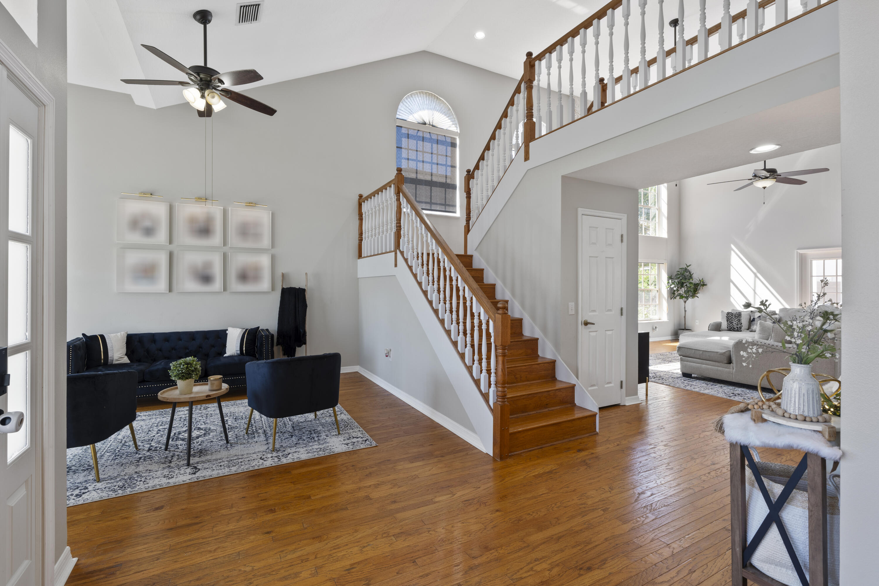 2639 Lowell Circle Melbourne, FL 32935 - Photo 5 of 46 a living room with furniture or wooden floor and a chandelier