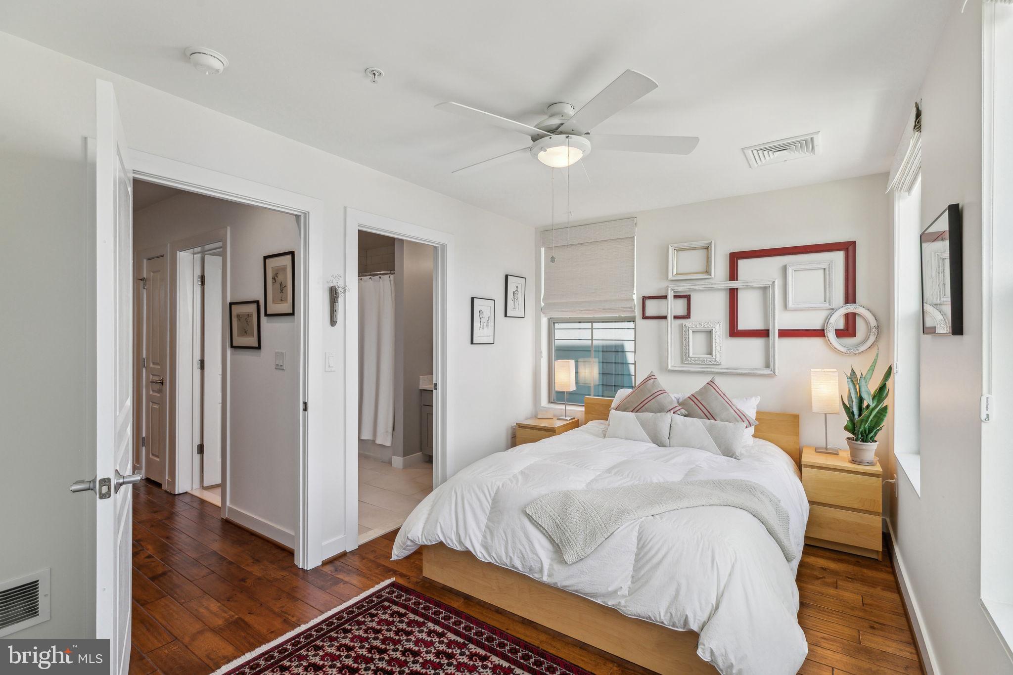 410 Reed Street Philadelphia, PA 19147 - Photo 14 of 39 a bedroom with a bed and a mirror