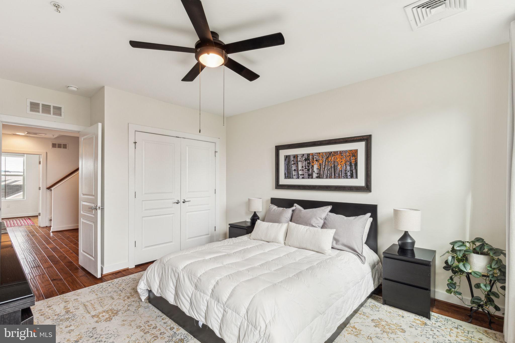 410 Reed Street Philadelphia, PA 19147 - Photo 17 of 39 a bedroom with bed and a painting on the wall