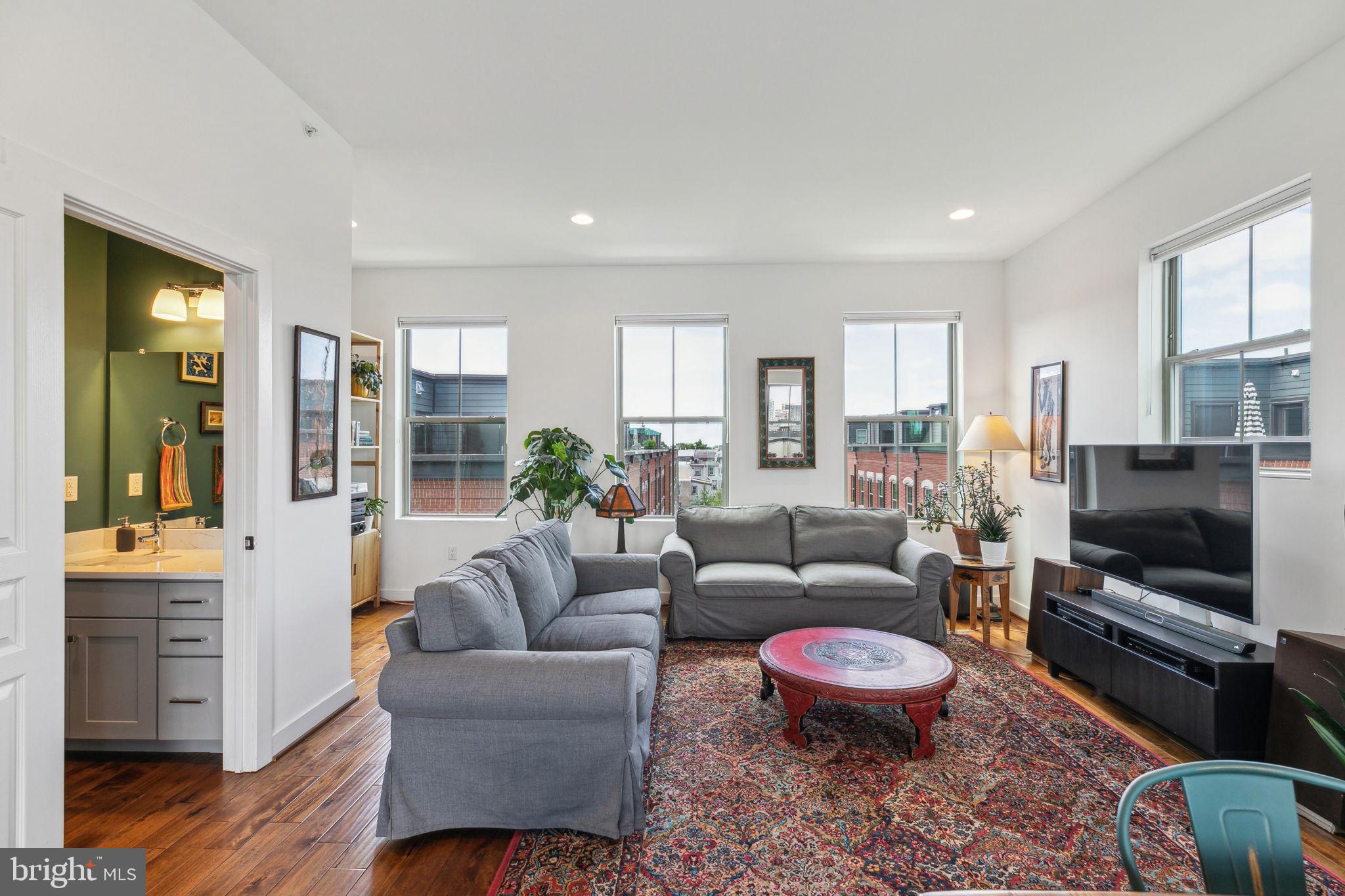 410 Reed Street Philadelphia, PA 19147 - Photo 20 of 39 a living room with furniture and a flat screen tv