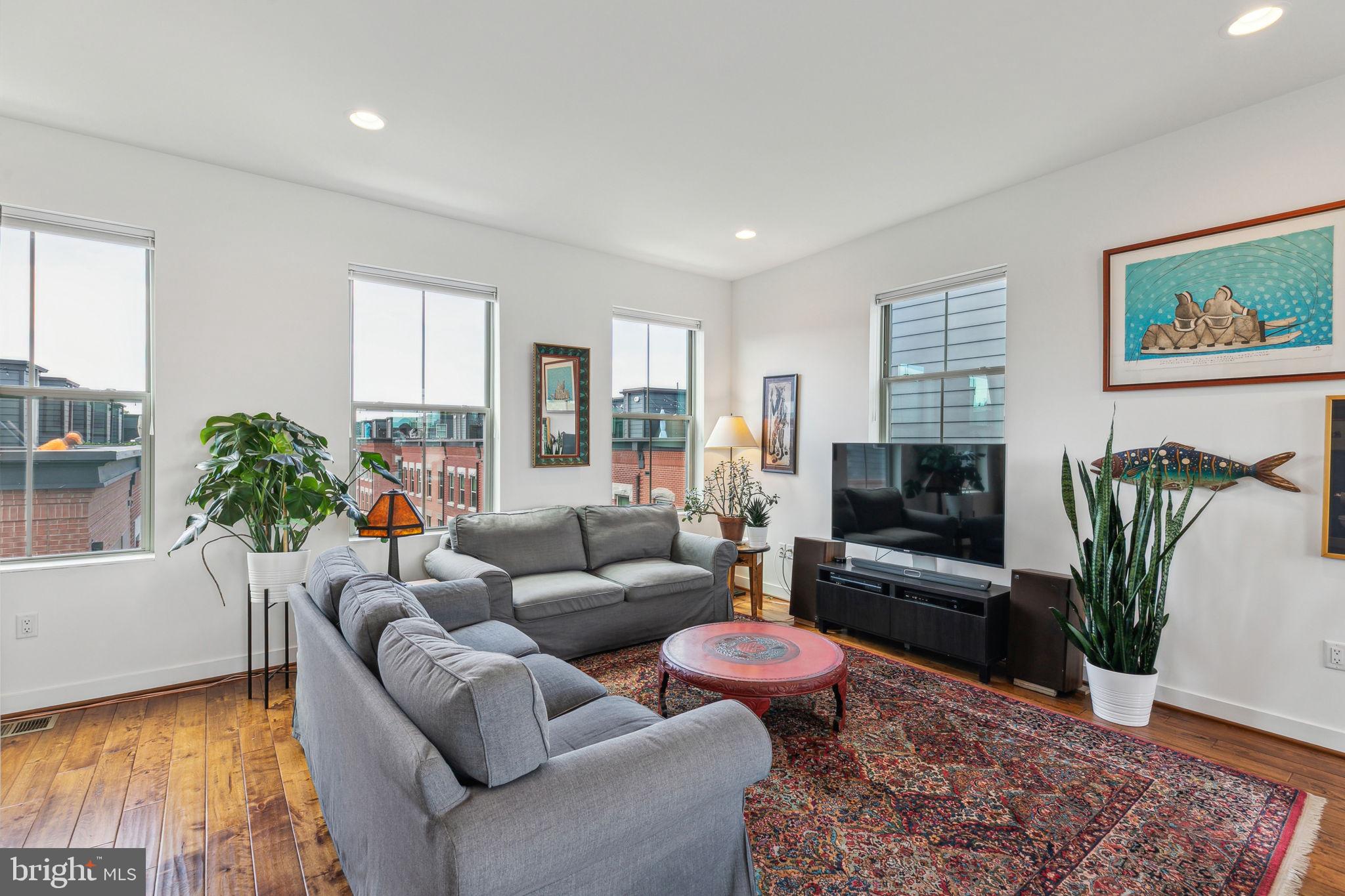 410 Reed Street Philadelphia, PA 19147 - Photo 21 of 39 a living room with furniture potted plant and a window