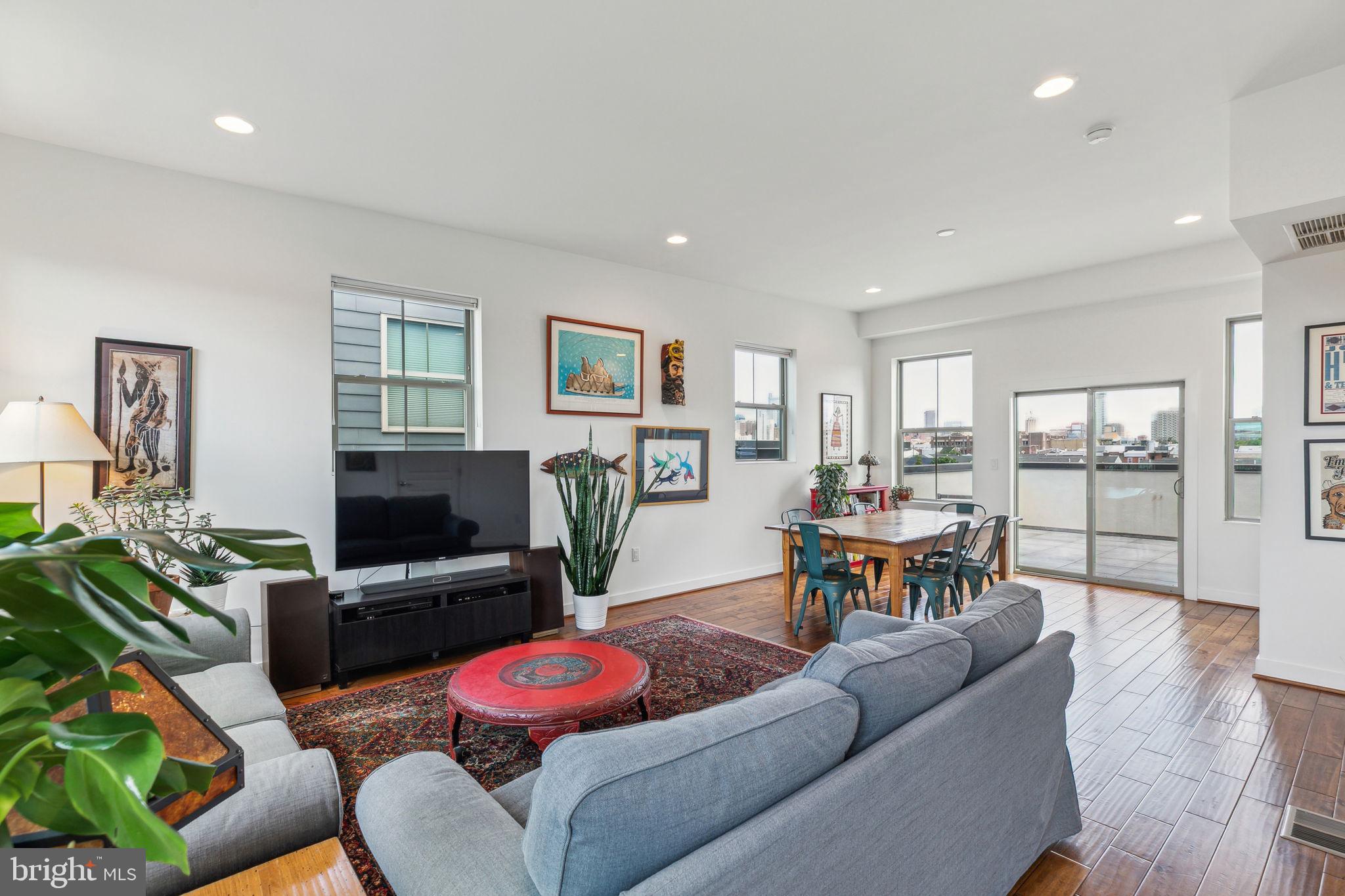 410 Reed Street Philadelphia, PA 19147 - Photo 23 of 39 a living room with furniture and a flat screen tv