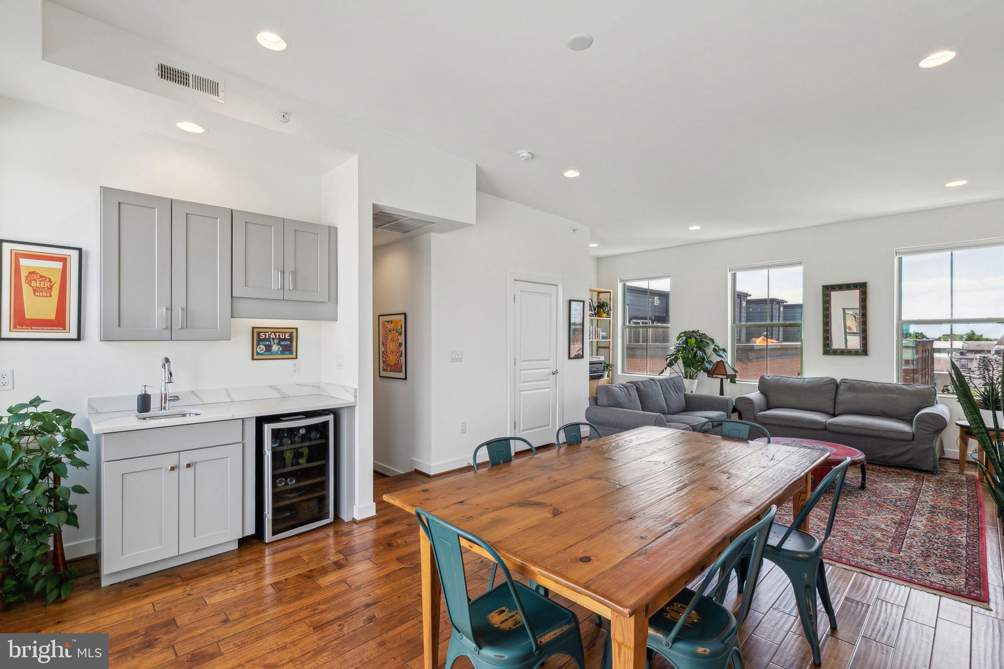 410 Reed Street Philadelphia, PA 19147 - Photo 25 of 39 a living room with a table chairs and kitchen view