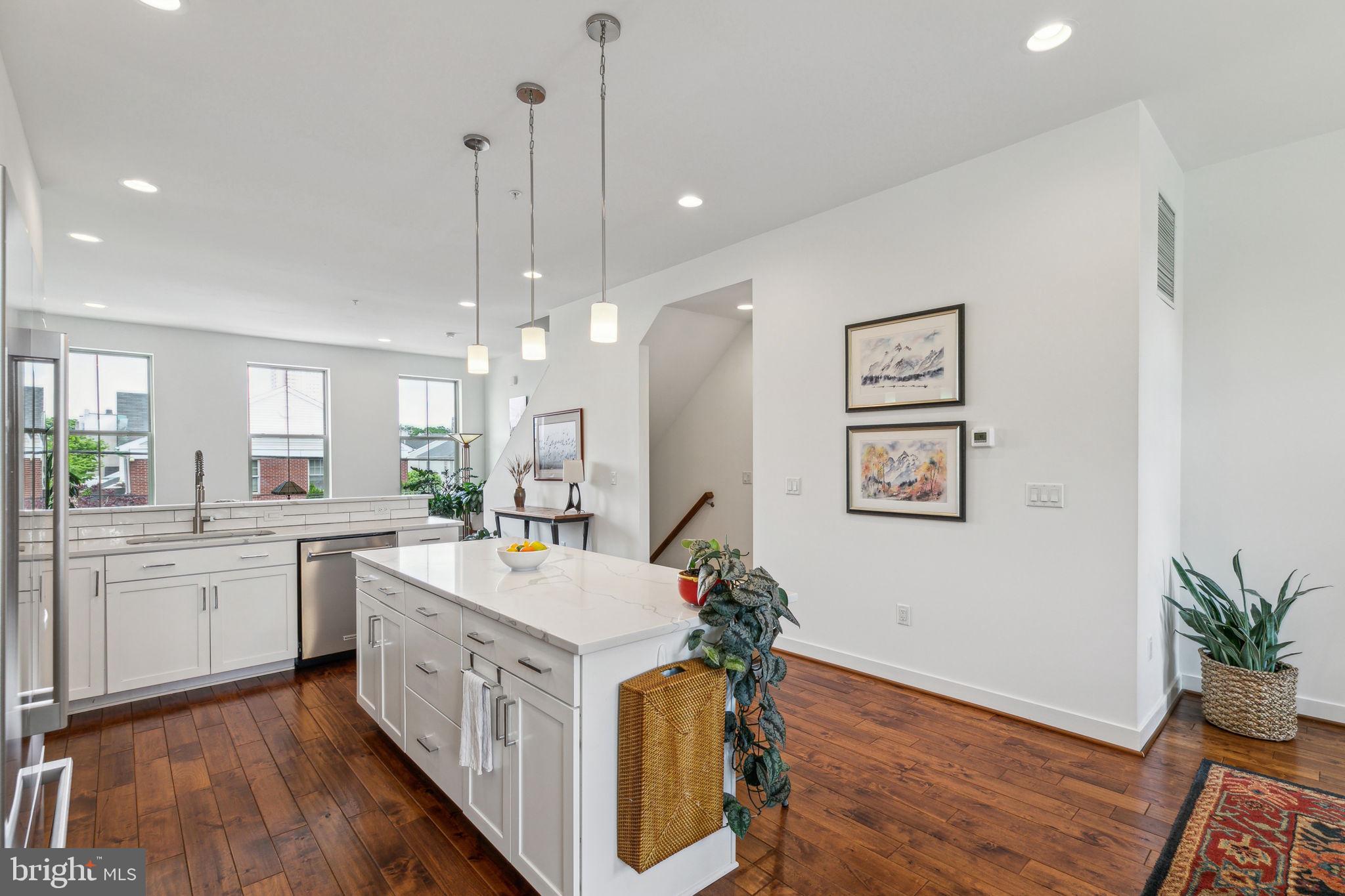 410 Reed Street Philadelphia, PA 19147 - Photo 3 of 39 a kitchen with a sink stove and wooden floor