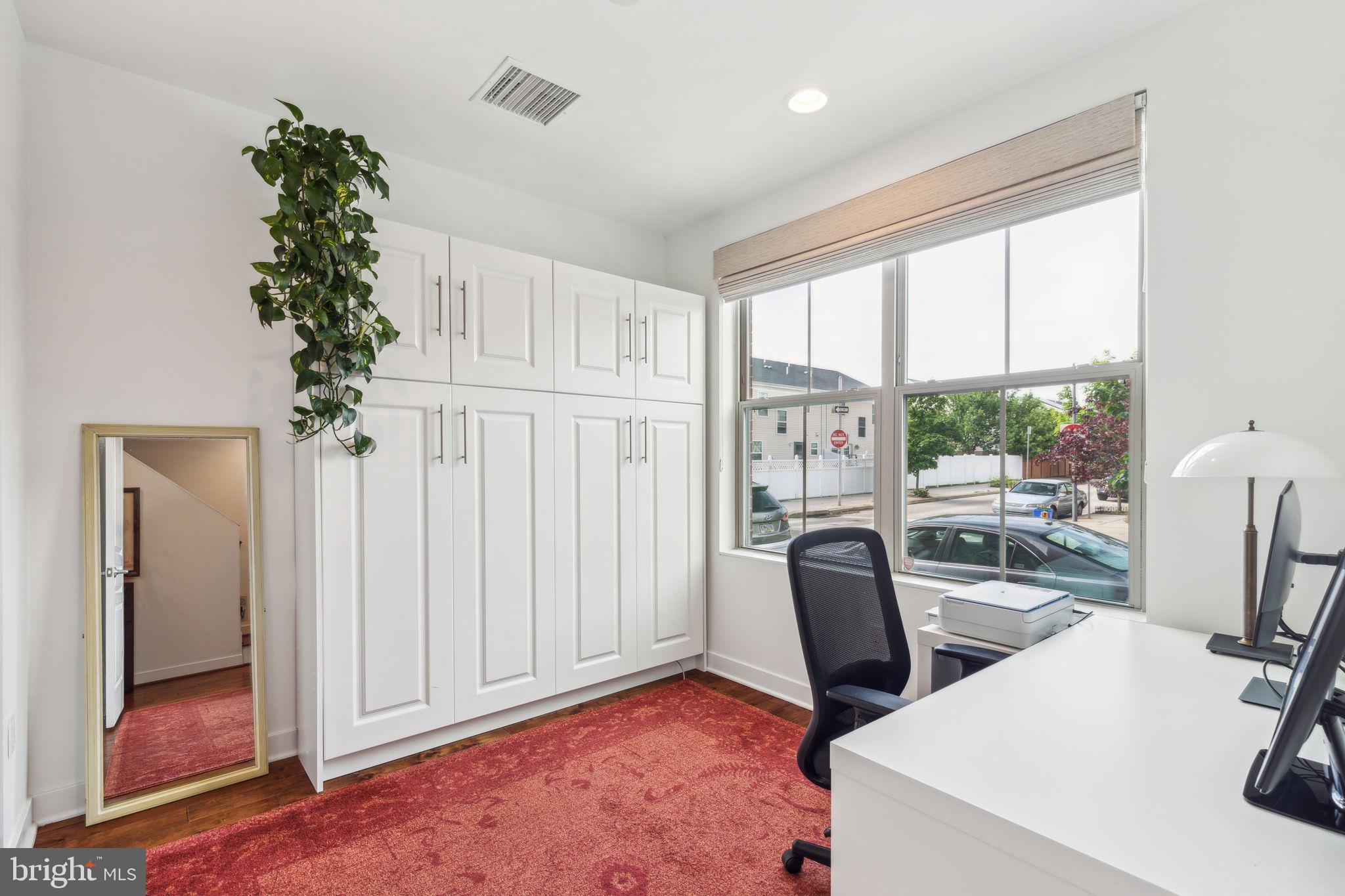 410 Reed Street Philadelphia, PA 19147 - Photo 31 of 39 a view of a workspace with furniture and a window