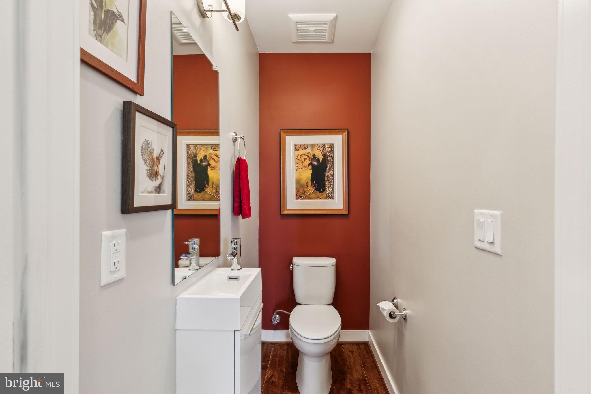 410 Reed Street Philadelphia, PA 19147 - Photo 9 of 39 a white toilet sitting next to a bathroom sink