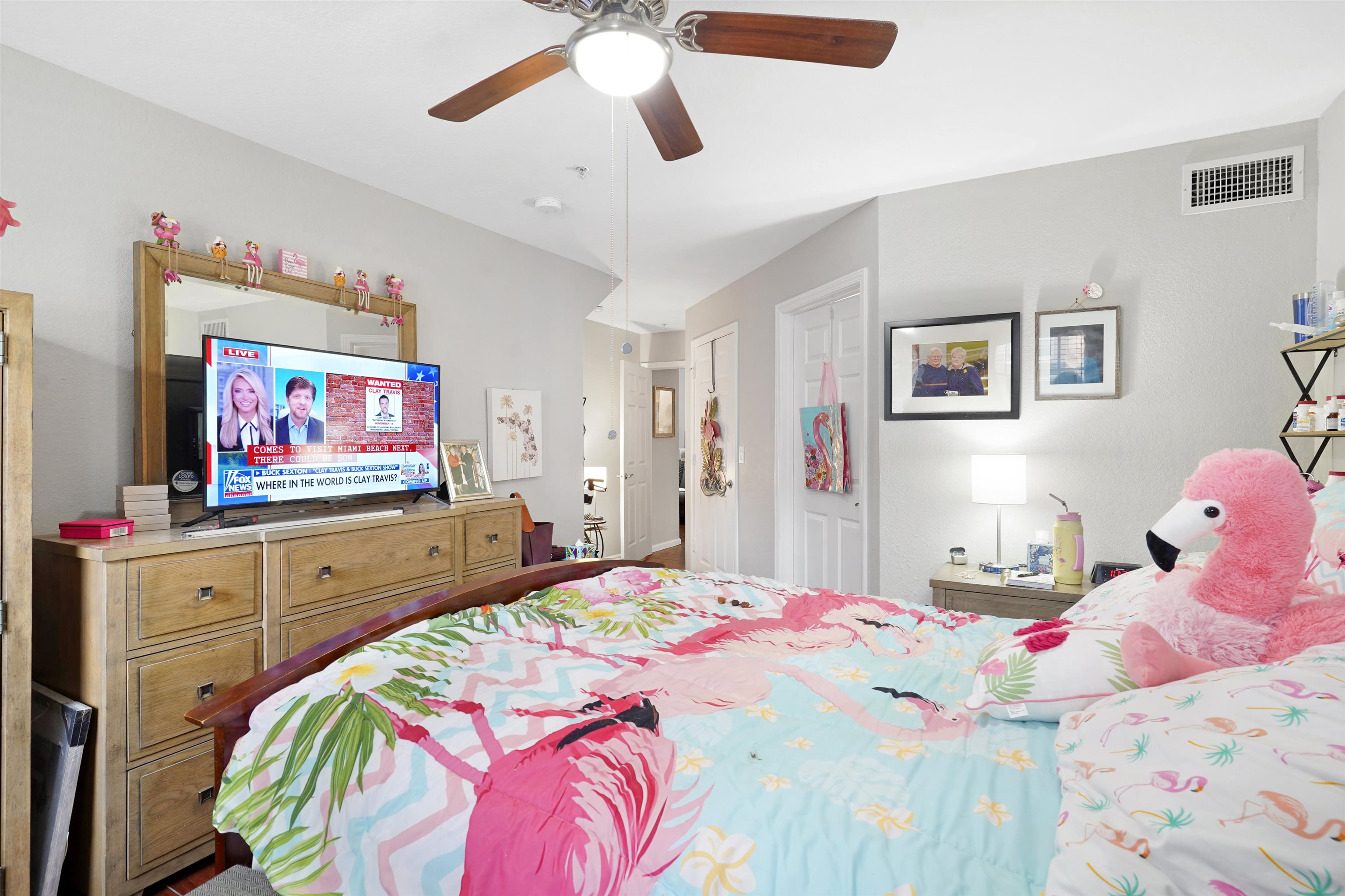 10075 Gate Parkway, Unit 203 Jacksonville, FL 32246 - Photo 10 of 34 a bedroom with bed and wooden floor