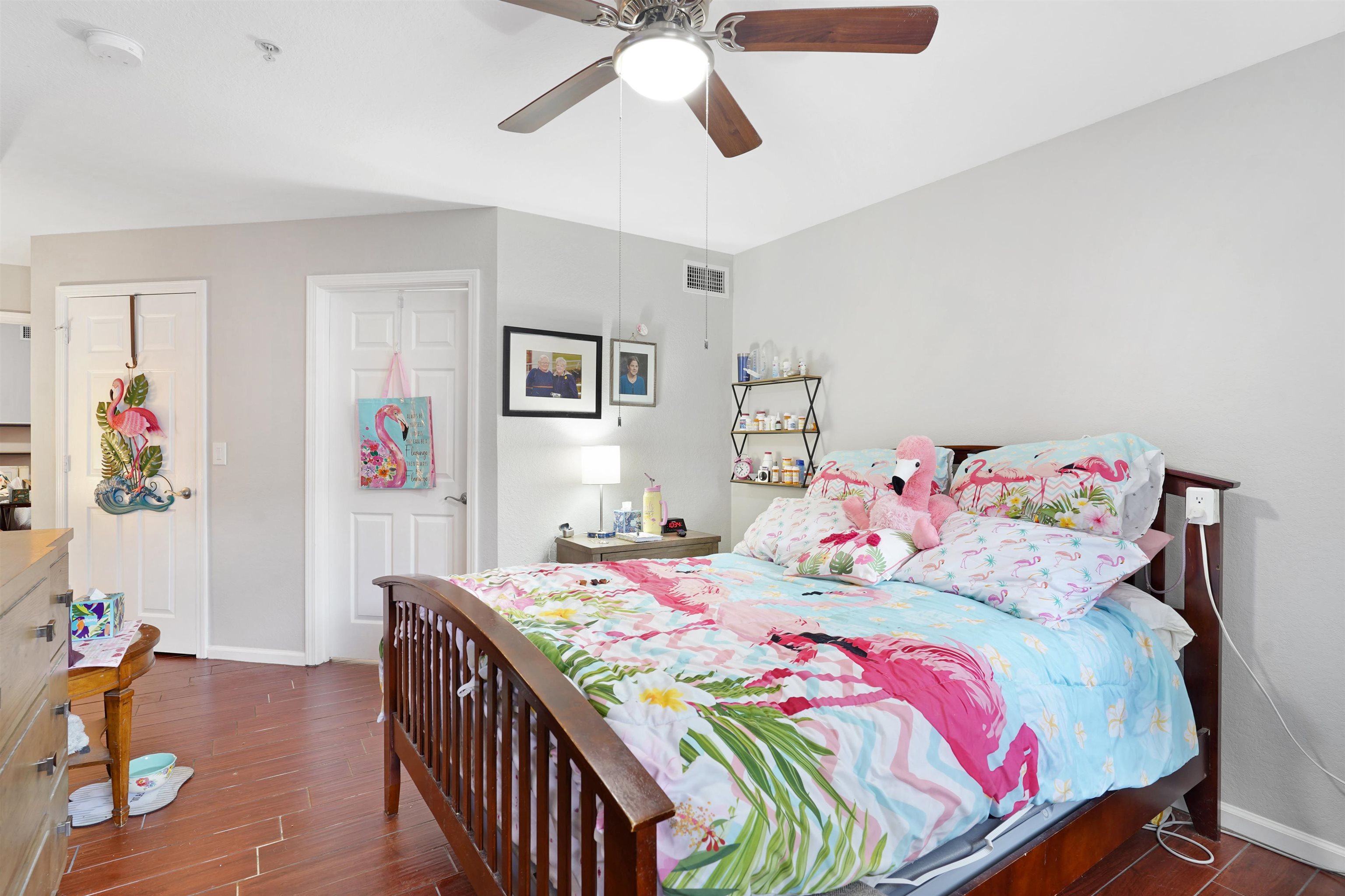 10075 Gate Parkway, Unit 203 Jacksonville, FL 32246 - Photo 11 of 34 a bedroom with a bed that has a blanket on the wall and a baby crib