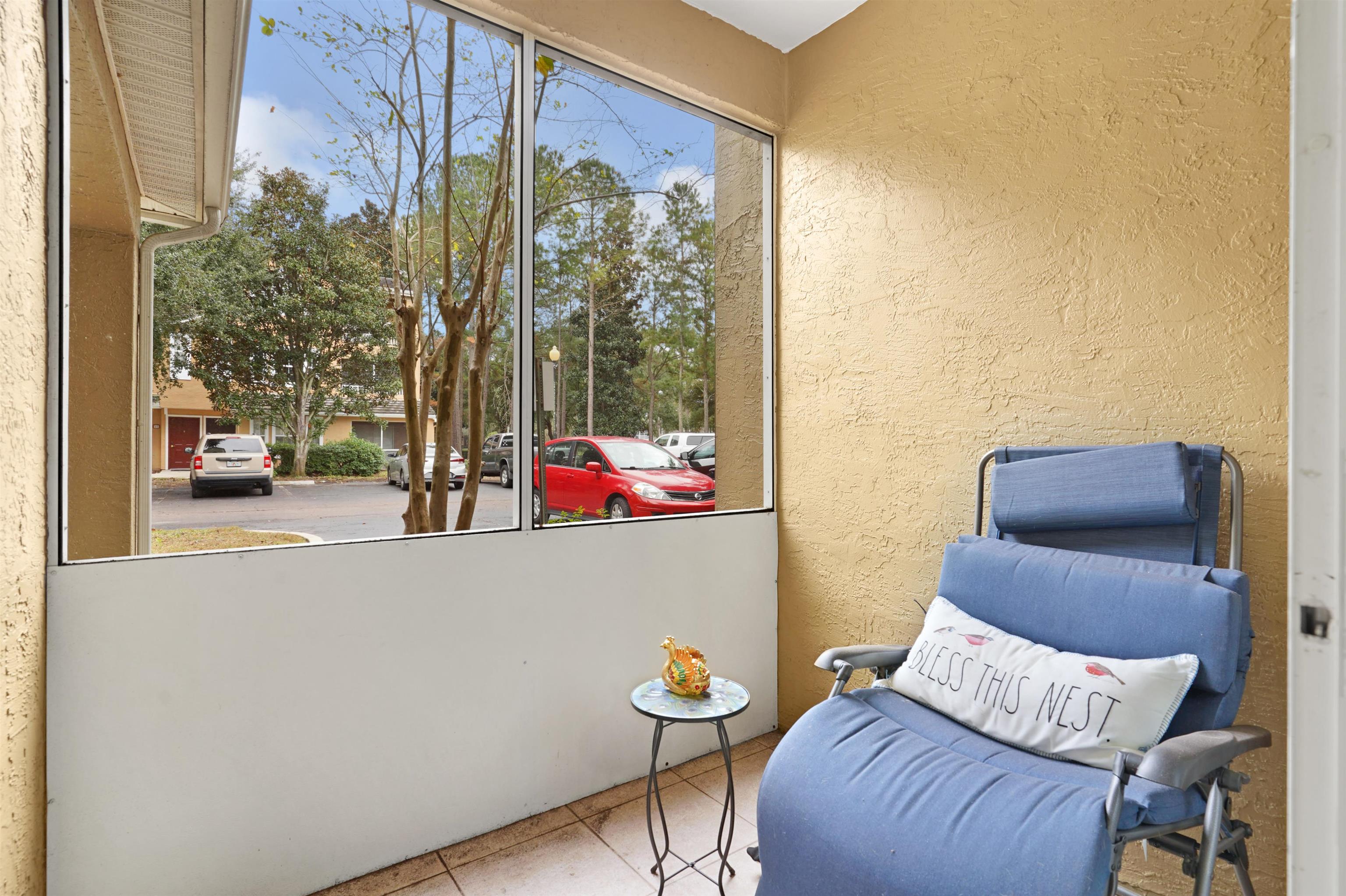 10075 Gate Parkway, Unit 203 Jacksonville, FL 32246 - Photo 15 of 34 a living room with furniture and a potted plant