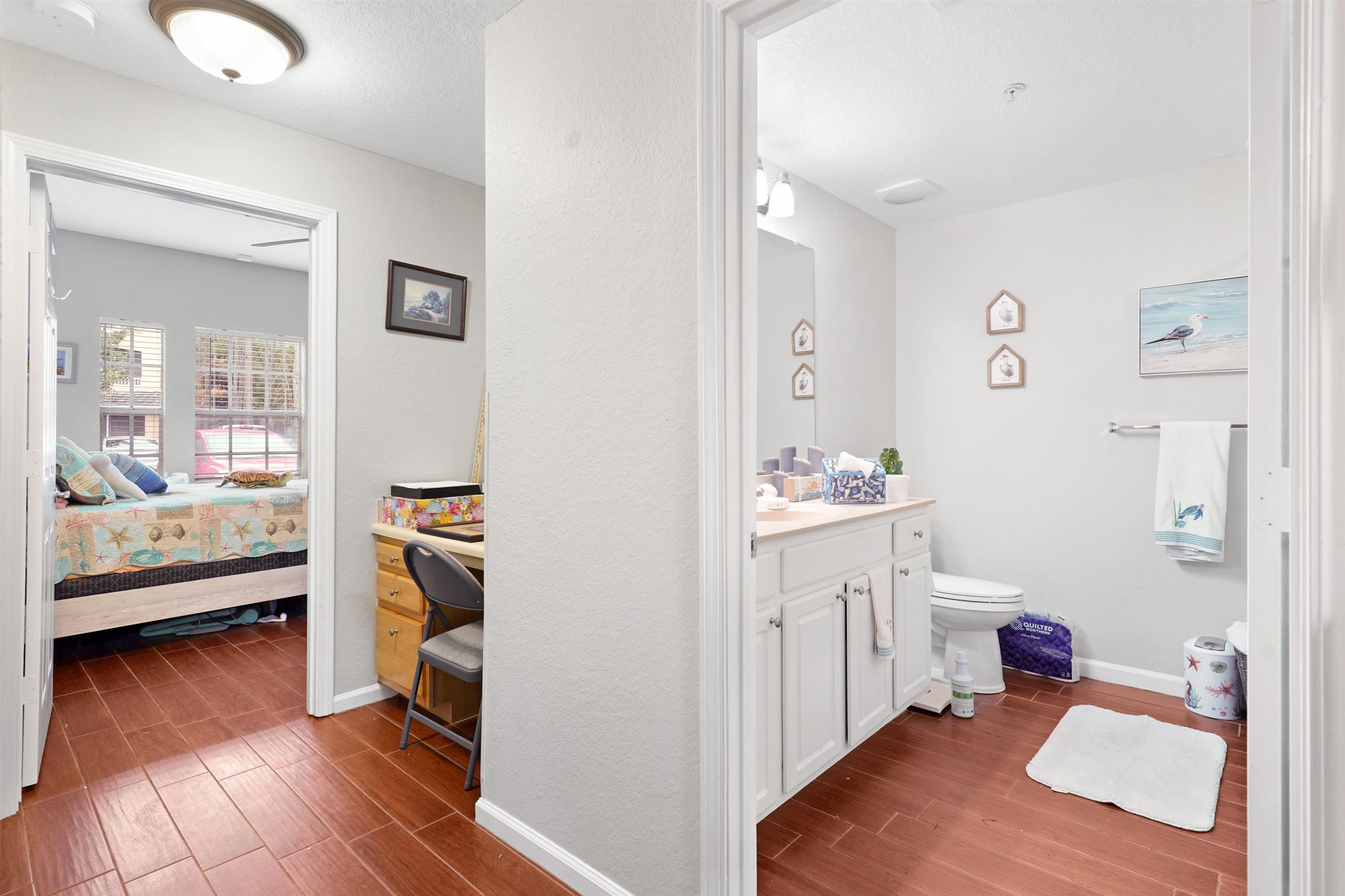 10075 Gate Parkway, Unit 203 Jacksonville, FL 32246 - Photo 21 of 34 Ensuite bathroom featuring wood tiled floors and vanity