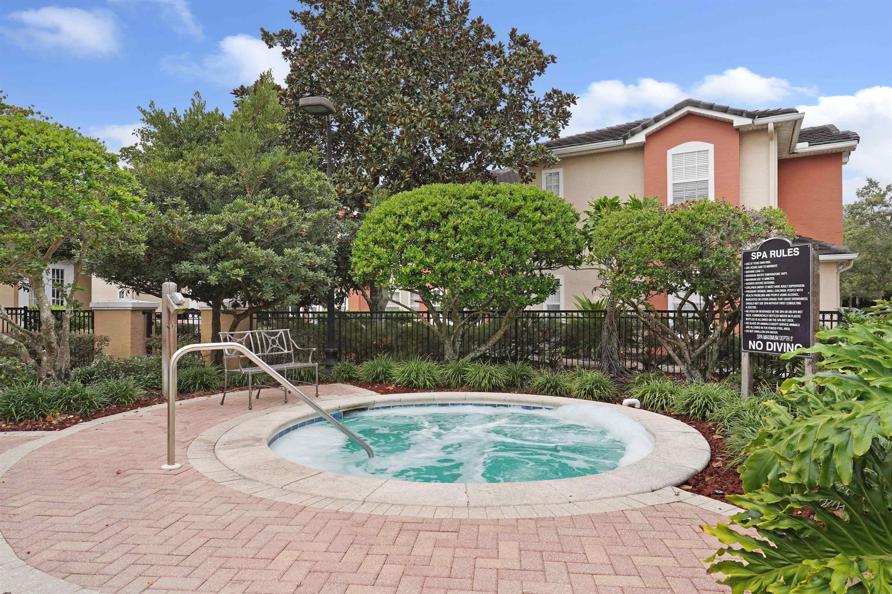 10075 Gate Parkway, Unit 203 Jacksonville, FL 32246 - Photo 31 of 34 a view of a house with a backyard and trees