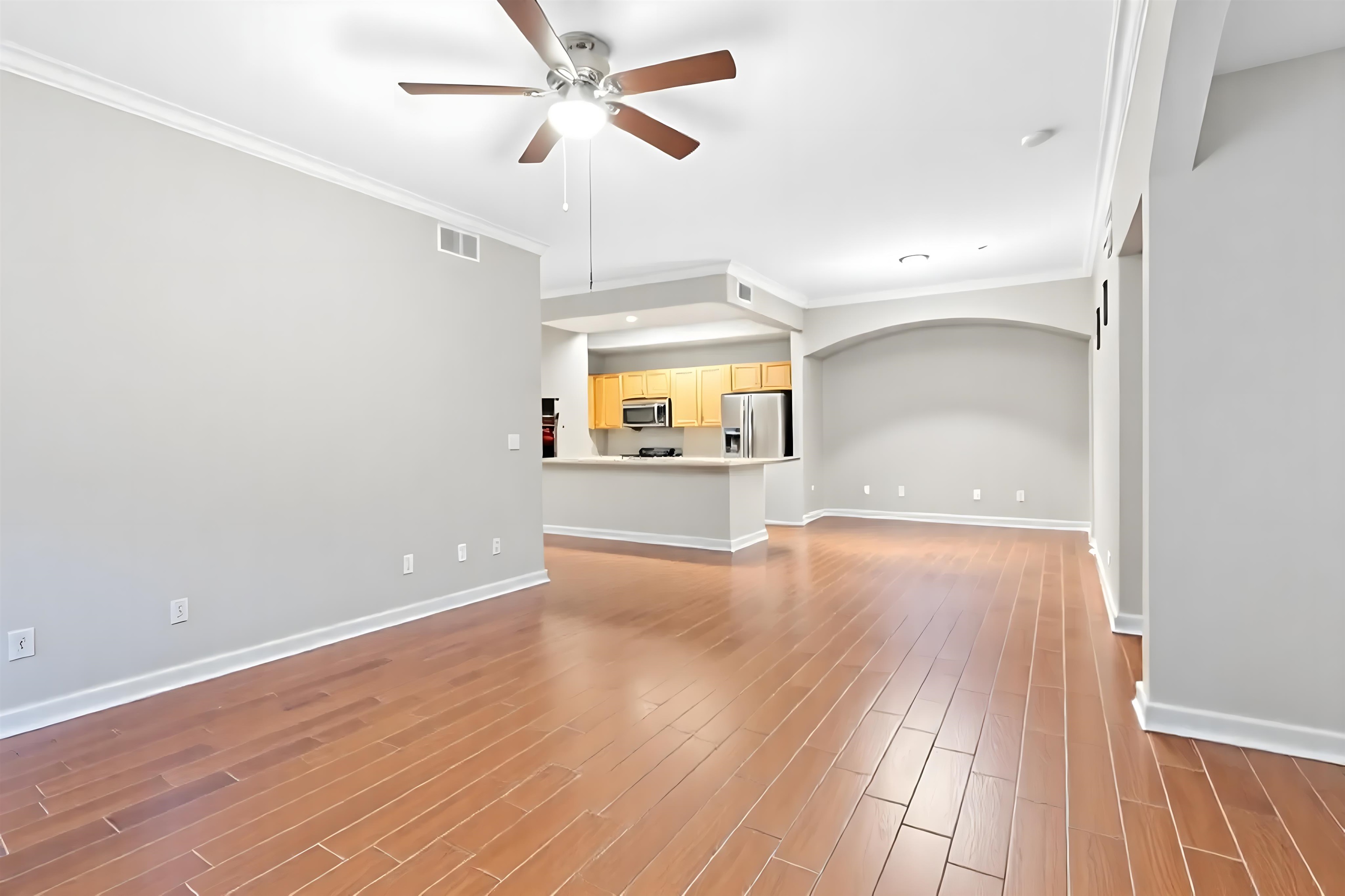 10075 Gate Parkway, Unit 203 Jacksonville, FL 32246 - Photo 33 of 34 wooden floor in an empty room with a window