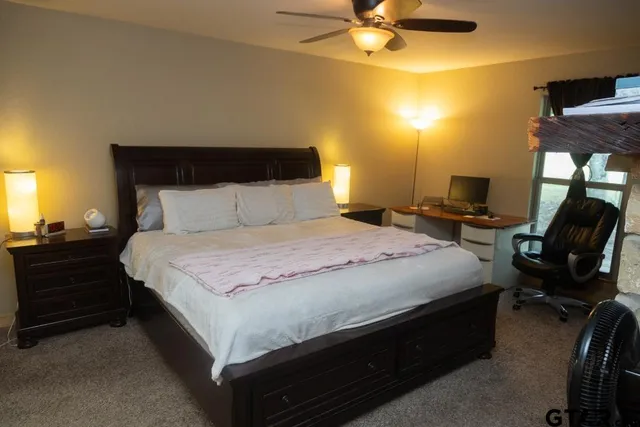 a bedroom with a bed and cabinets