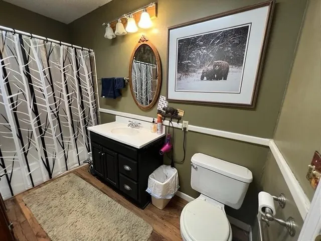 a bedroom with a bed a desk and chair