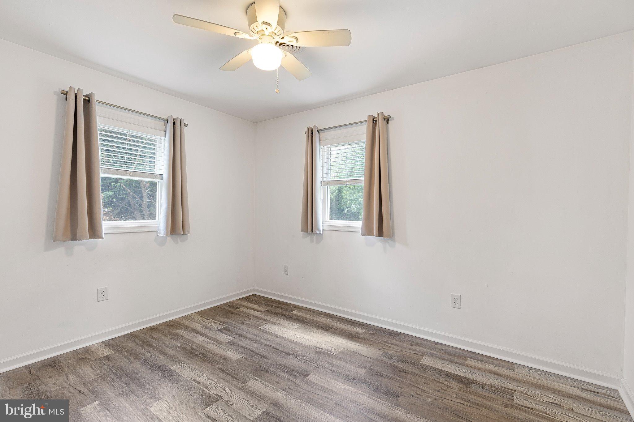 370 Big Elk Chapel Road Elkton, MD 21921 - Photo 19 of 29 a view of empty room with wooden floor and fan