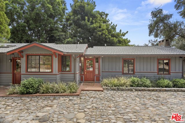 a kitchen with cabinets and white appliances