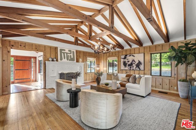 a view of a table and chairs in the garden
