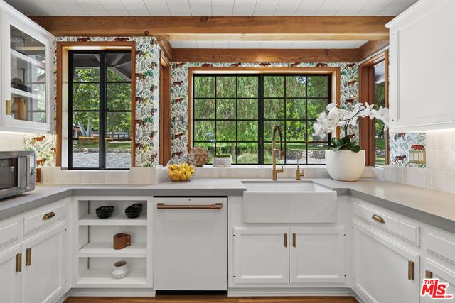 a spacious bedroom with a bed and a large window