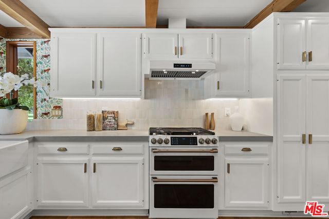 a spacious bedroom with a large bed and a large window