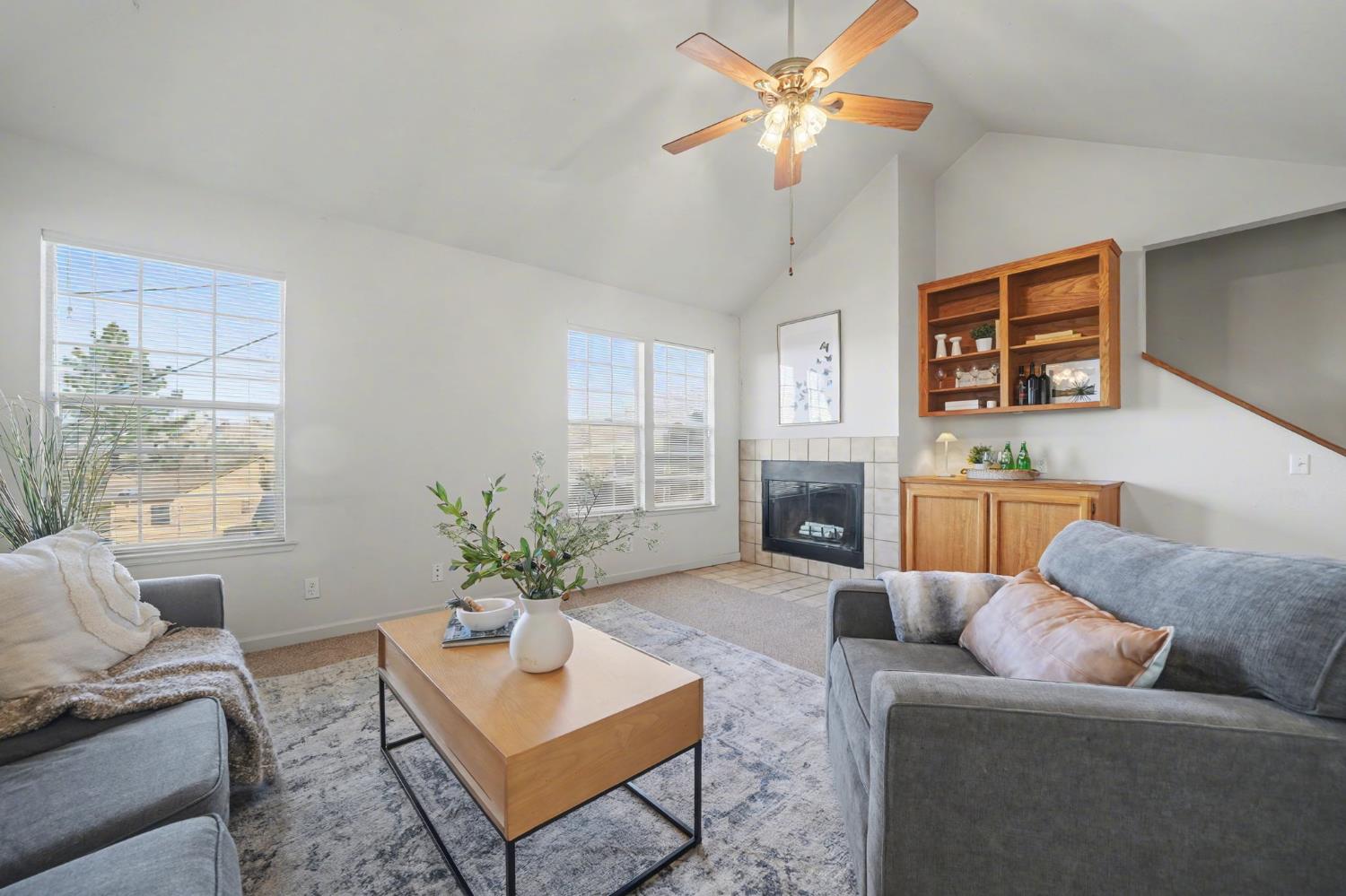 238 Highland Drive Sutter Creek, CA 95685 - Photo 20 of 52 a living room with furniture a chandelier and a fireplace