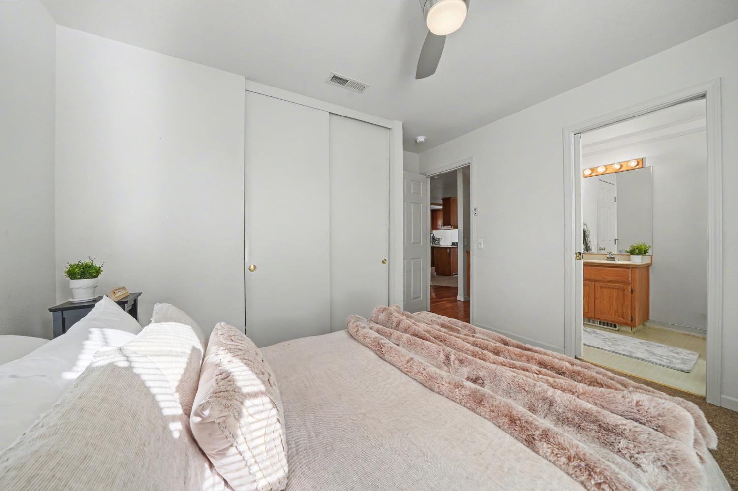 238 Highland Drive Sutter Creek, CA 95685 - Photo 22 of 52 a bedroom with a bed and a mirror