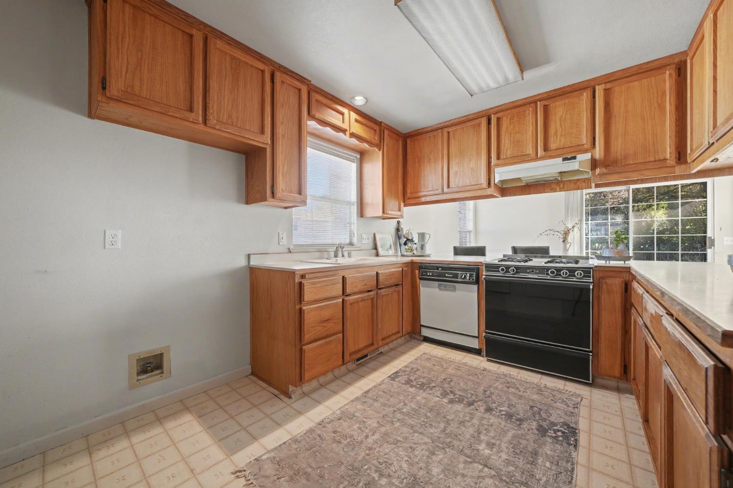 238 Highland Drive Sutter Creek, CA 95685 - Photo 24 of 52 a kitchen with a stove sink and cabinets