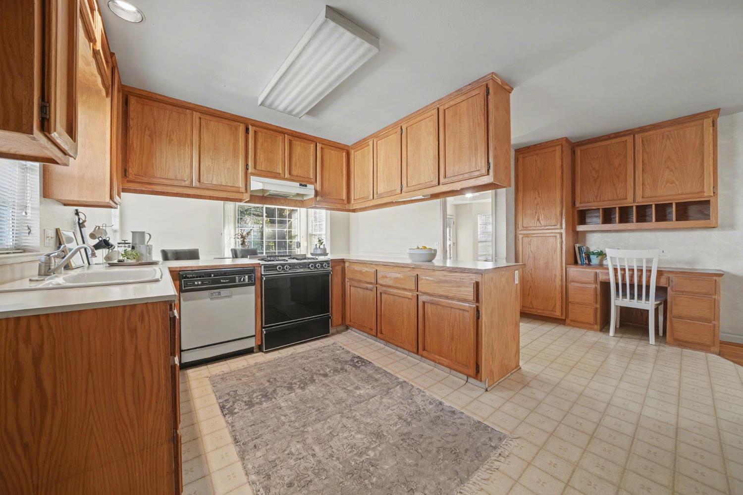 238 Highland Drive Sutter Creek, CA 95685 - Photo 25 of 52 a kitchen with a sink a counter top space and cabinets