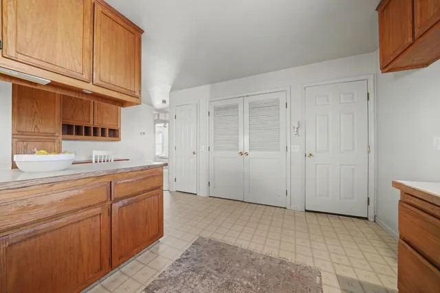 a view of a kitchen with cabinets