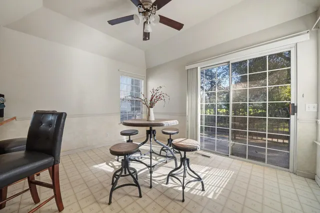 a work room with furniture and a window