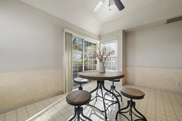 a view of a room with furniture and wooden floor