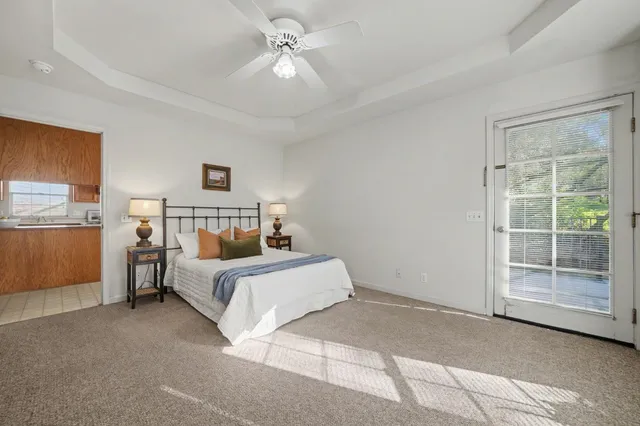 a bed room with a bed and a window