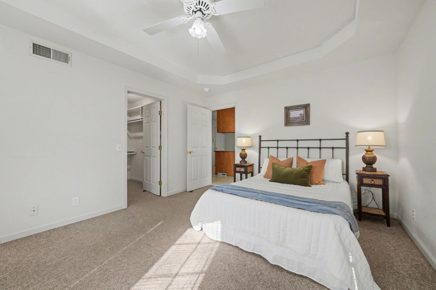 238 Highland Drive Sutter Creek, CA 95685 - Photo 35 of 52 a bedroom with a bed and a chandelier