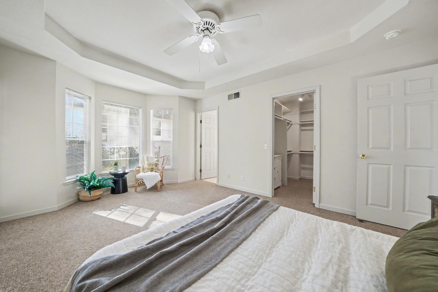 238 Highland Drive Sutter Creek, CA 95685 - Photo 36 of 52 a bedroom with a bed and a chandelier